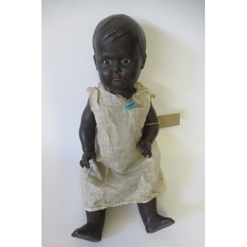 5 - A Rheinische Gummi und Celluloid-Fabrik socket head doll, with brown glass fixed eyes, moulded hair,... 