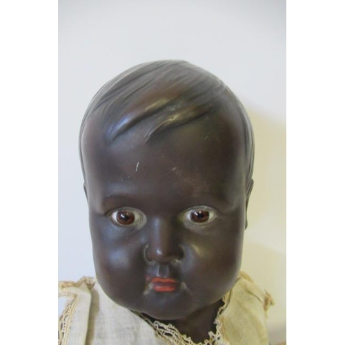 5 - A Rheinische Gummi und Celluloid-Fabrik socket head doll, with brown glass fixed eyes, moulded hair,... 