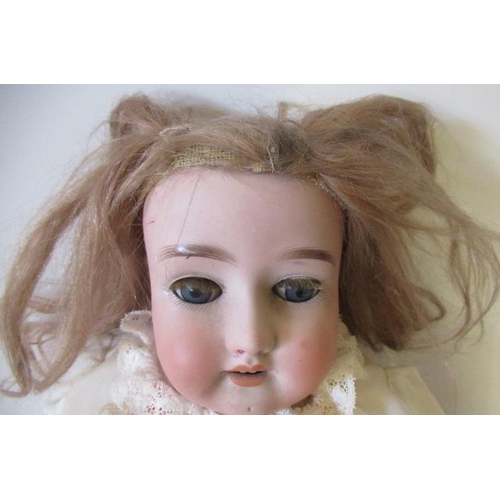 65 - A Simon & Halbig bisque socket head doll, with blue glass sleeping eyes, open mouth and teeth, blond... 