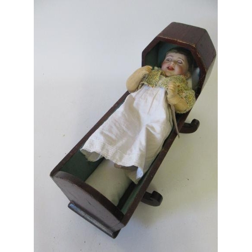 7 - An SFBJ bisque head character doll, with blue glass sleeping eyes, open mouth, flock hair and compos... 