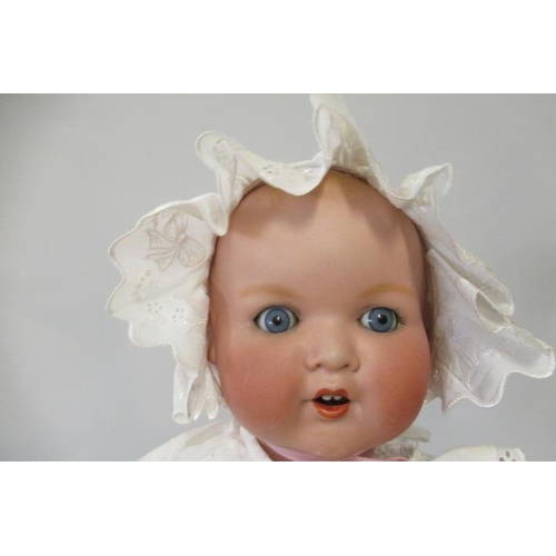 70 - An Armand Marseille bisque socket head doll, with blue glass sleeping eyes, open mouth, teeth, mould... 