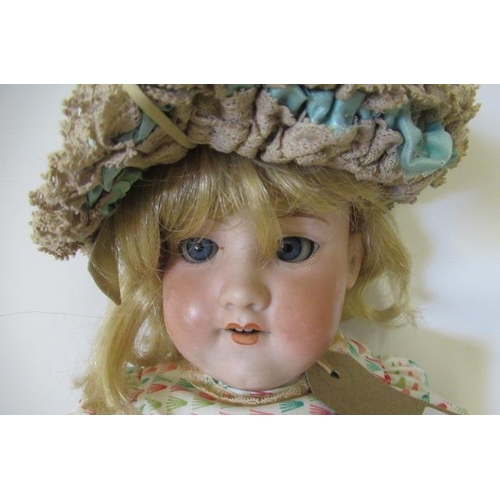 72 - An Armand Marseille bisque socket head doll, with blue glass sleeping eyes, open mouth, teeth, pierc... 