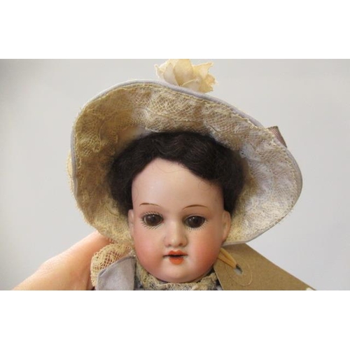 79 - An Armand Marseille bisque socket head doll, with blue glass sleeping eyes, open mouth, teeth, compo... 