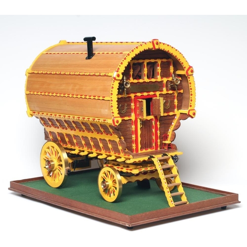 909 - A well made model of a horse drawn gypsy caravan, wood construction, fine decoration with detailed i... 