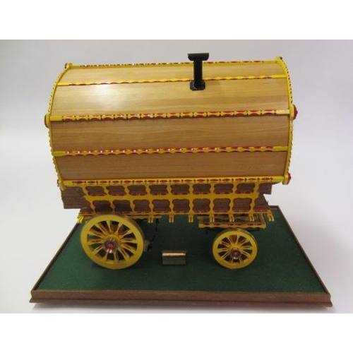 909 - A well made model of a horse drawn gypsy caravan, wood construction, fine decoration with detailed i... 