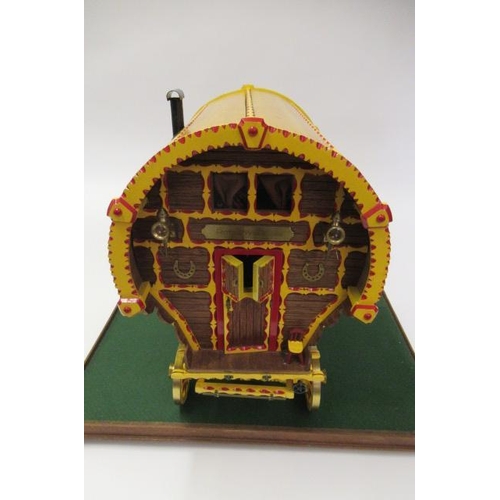 909 - A well made model of a horse drawn gypsy caravan, wood construction, fine decoration with detailed i... 