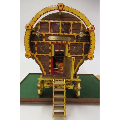 909 - A well made model of a horse drawn gypsy caravan, wood construction, fine decoration with detailed i... 