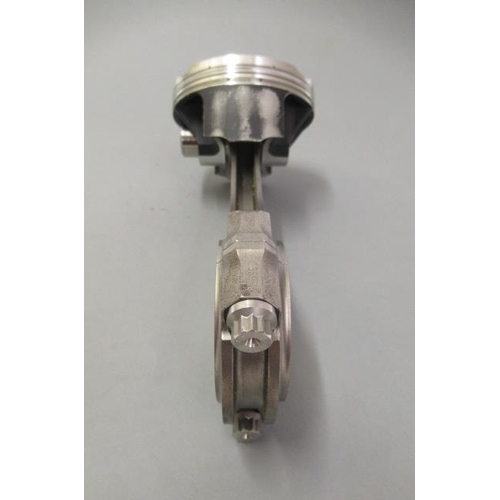 910 - A Pankl McLaren Mercedes Formula One piston and connecting rod removed from 2007 engine for return t... 