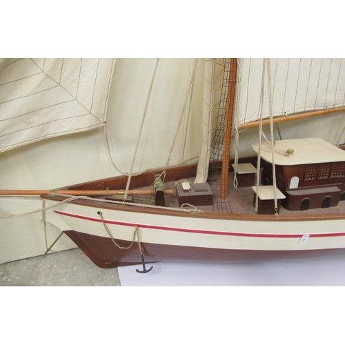 924 - A large model of two mast sail boat of wooden construction, finished in white with rigging and cloth... 