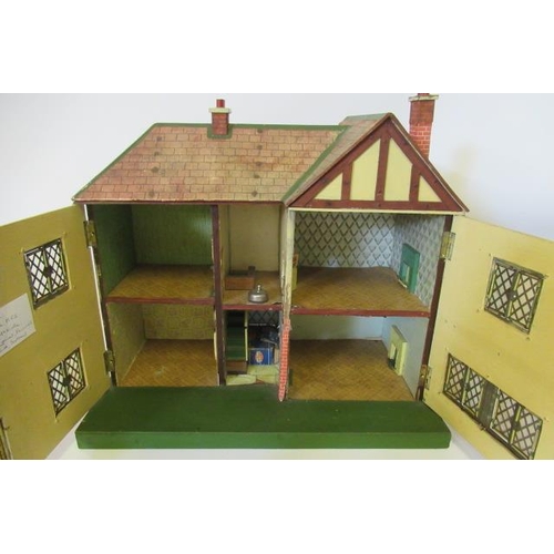 93 - A Lines Bros type doll's house, with metal windows, porch canopy, front door, four interior doors, t... 