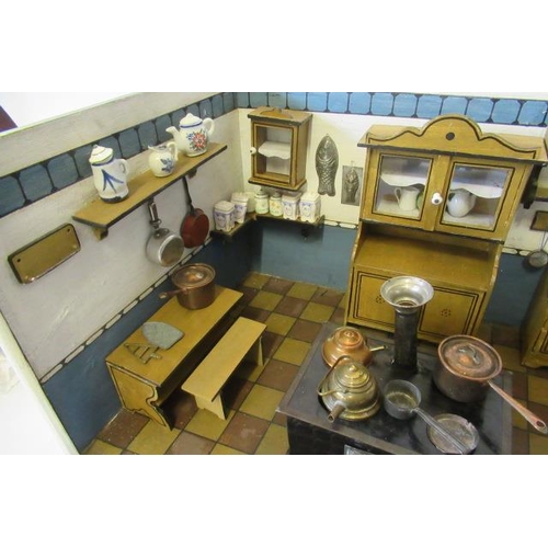 96 - A German doll's house kitchen and contents, with delft rack, ceramics, glassware, large metal oven, ... 