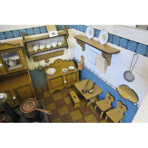 96 - A German doll's house kitchen and contents, with delft rack, ceramics, glassware, large metal oven, ... 