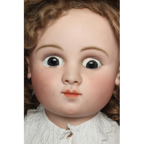 125 - A large Jules Nicholas Steiner bisque socket head doll, with closed mouth and pierced ears, blue gla... 