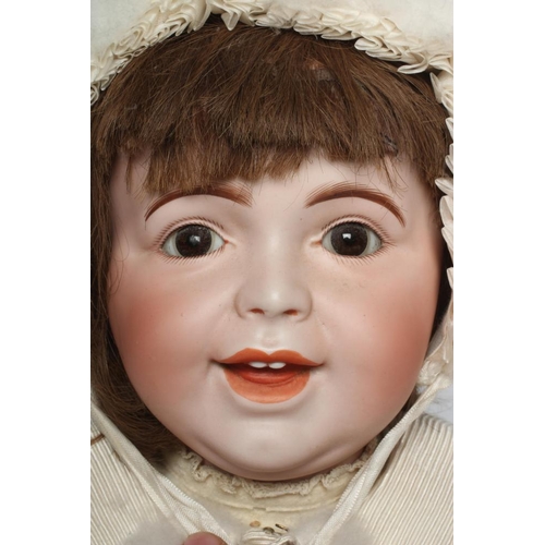 139 - An SFBJ bisque socket head character doll, with brown glass sleeping eyes, open-closed mouth, teeth,... 