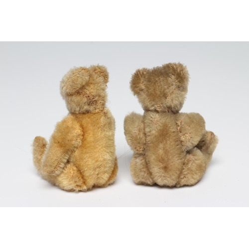 157 - Two early Steiff miniature teddies, with yellow plush, jointed bodies, black beaded yes and sewn nos... 