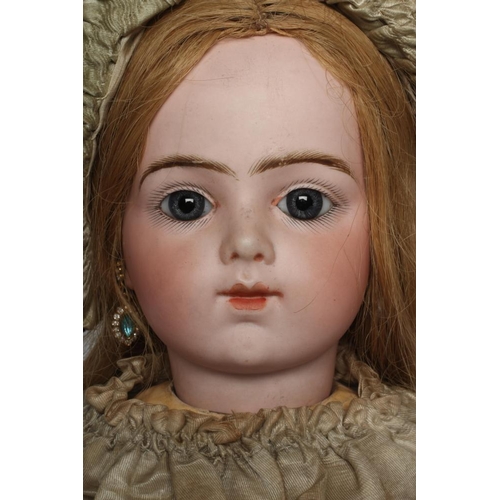 19 - A rare Bru Jne. & Cie bisque socket head doll, with blue glass paperweight eyes, closed mouth, pierc... 