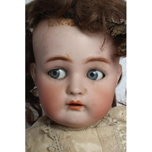 20 - A Kammer & Reinhardt bisque socket head flirty doll, with blue glass flirting eyes, metal sleeping l... 