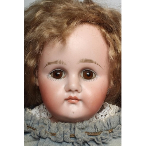 53 - A Kestner bisque shoulder head doll, with brown glass fixed eyes, closed mouth, light brown wig, joi... 