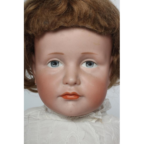 55 - A Kammer & Reinhardt bisque socket head solemn girl, with painted features, auburn wig, wood and com... 