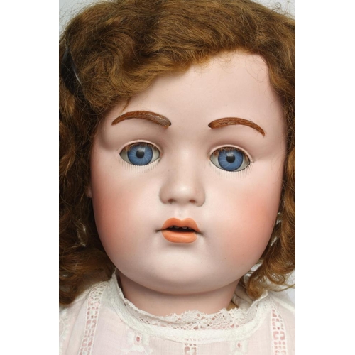 58 - A J. D. Kestner bisque socket head doll, with blue glass sleeping eyes, open mouth, applied teeth, i... 