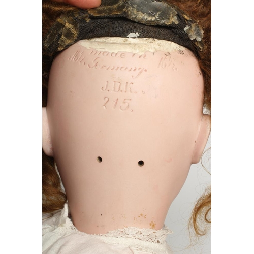 58 - A J. D. Kestner bisque socket head doll, with blue glass sleeping eyes, open mouth, applied teeth, i... 