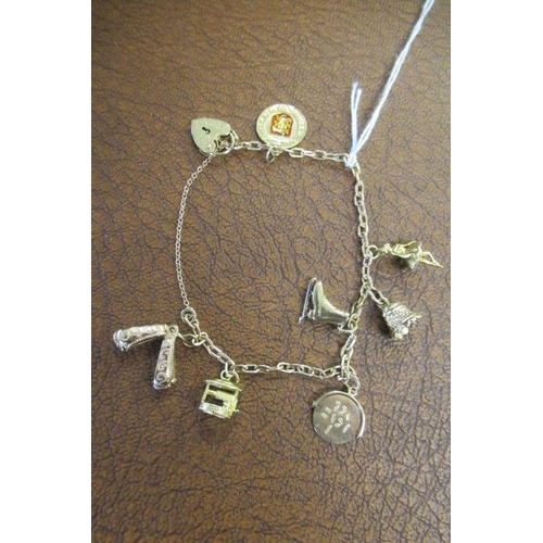 218 - 9CT GOLD CHARM BRACELET