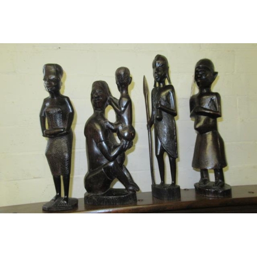 399 - FOUR DARK WOOD AFRICAN CARVED FIGURES