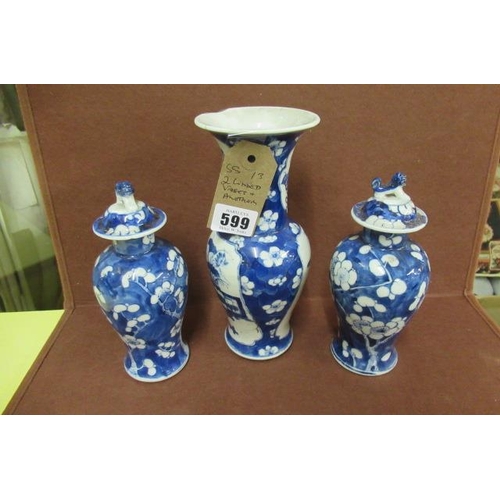 599 - TWO BLUE AND WHITE LIDDED VASES AND ANOTHER