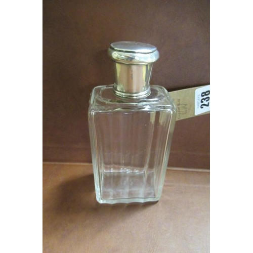 238 - WHITE METAL TOPPED GLASS BOTTLE