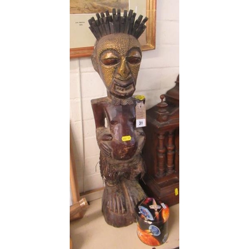 31 - CARVED AFRICAN FIGURE