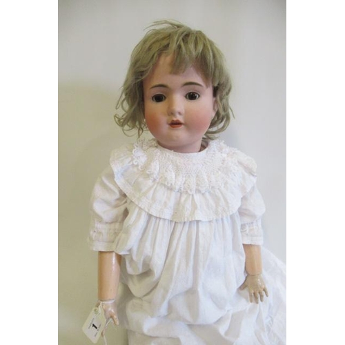 1 - A bisque socket head doll, comprising a Bruno Schmidt girl, with brown glass sleeping eyes, open mou... 