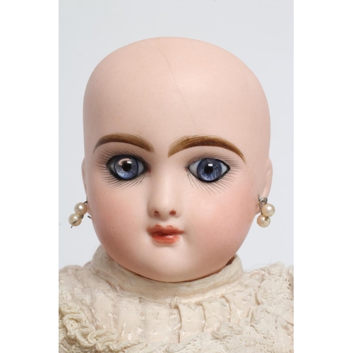 100 - A Bebe Jumeau bisque socket head doll, with blue glass paperweight fixed eyes, closed mouth, pierced... 