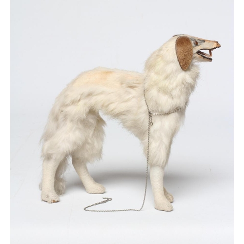 102 - A borzoir dog for a French fashion doll, of wooden construction, with fur covering, felt tongue and ... 