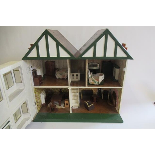 113 - A scratch built doll's house and contents, 1940s, with twin peak roof, bay windows and single hinge ... 