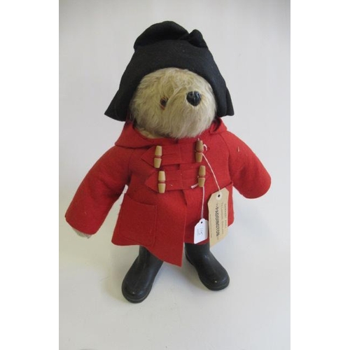 115 - A Paddington Bear, with amber eyes, red felt coat, black felt hat, PB black boots and label, 22