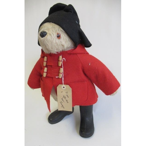 115 - A Paddington Bear, with amber eyes, red felt coat, black felt hat, PB black boots and label, 22