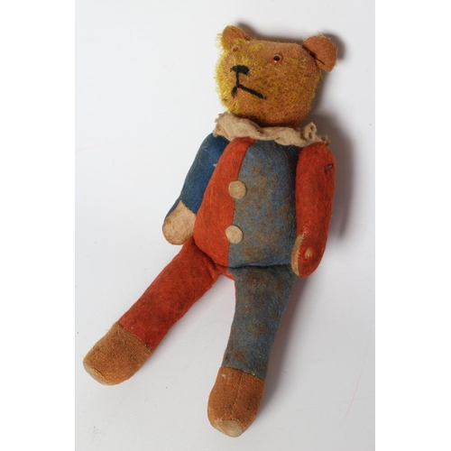 142 - A rare pre-war jester teddy, with orange glass eyes, sewn nose, orange plush, red and blue felt body... 