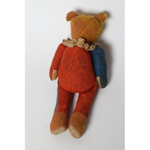 142 - A rare pre-war jester teddy, with orange glass eyes, sewn nose, orange plush, red and blue felt body... 