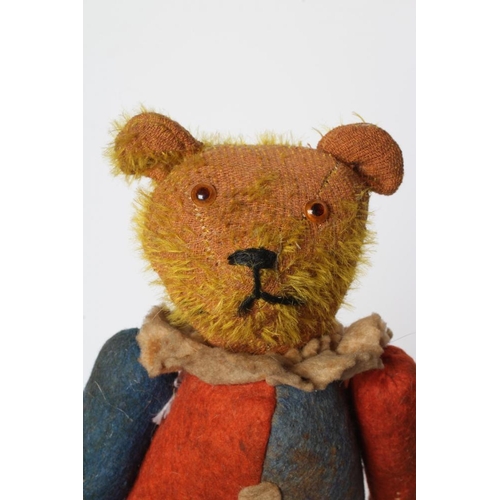 142 - A rare pre-war jester teddy, with orange glass eyes, sewn nose, orange plush, red and blue felt body... 