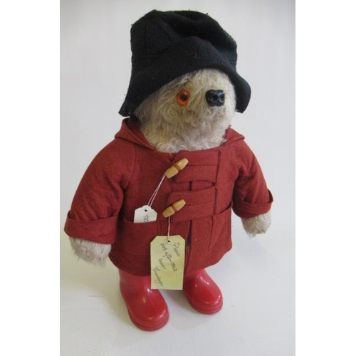 147 - A Paddington bear, with red coat, red wellies and label