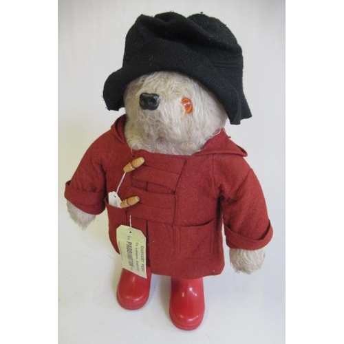 147 - A Paddington bear, with red coat, red wellies and label