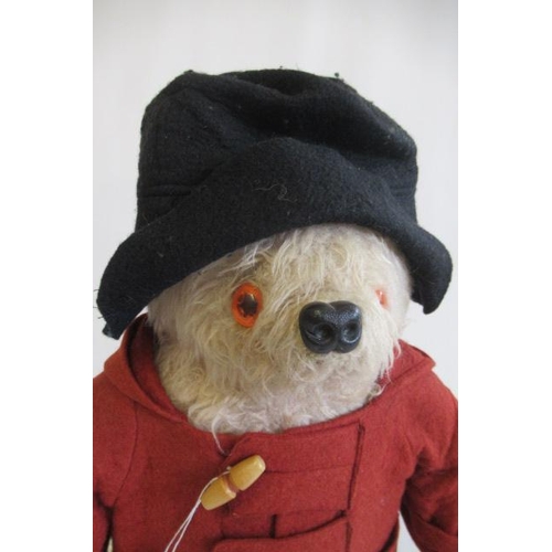 147 - A Paddington bear, with red coat, red wellies and label