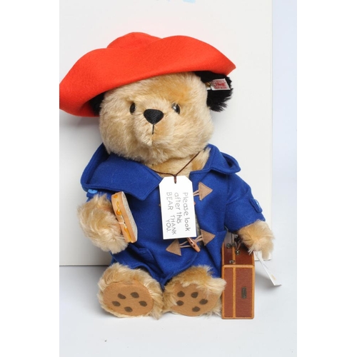 165 - A boxed Steiff Paddington Bear, with blue coat, marmalade sandwich, suitcase and hat