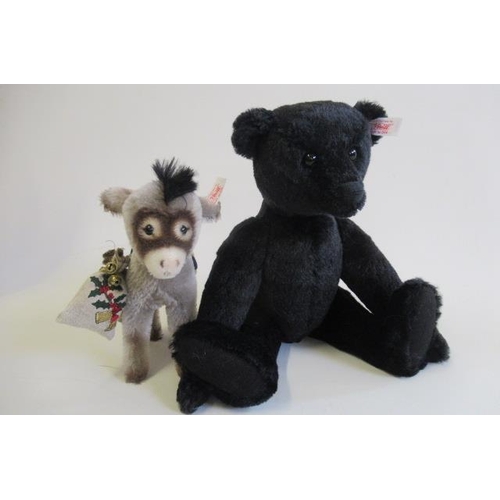 176 - Two boxed Steiff items, comprising a 35cm black bear and a Donkey