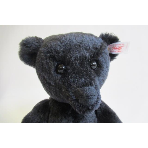 176 - Two boxed Steiff items, comprising a 35cm black bear and a Donkey