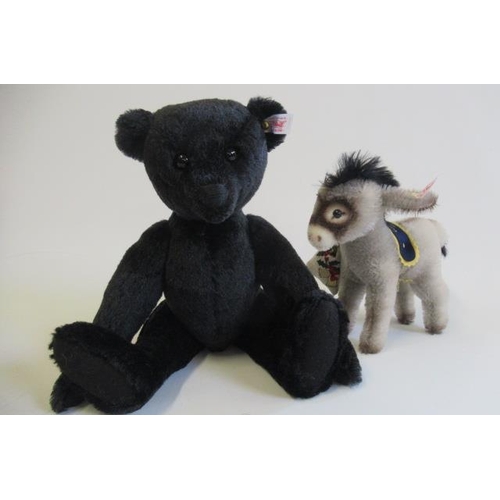 176 - Two boxed Steiff items, comprising a 35cm black bear and a Donkey