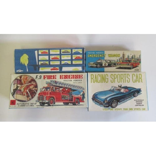 181 - A battery operated remote controlled sports car, friction powered fire department car by Schudo Japa... 