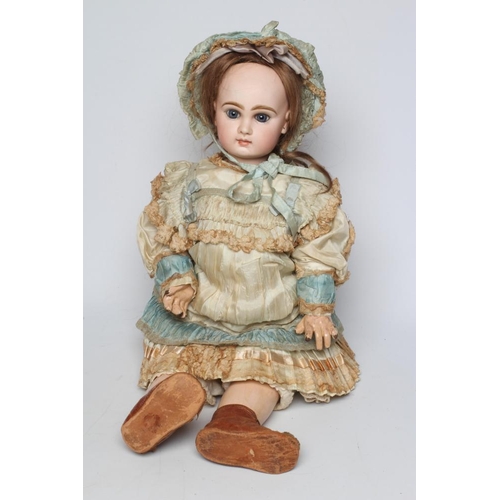 20 - A Tete Jumeau bisque socket head doll, with blue glass paperweight fixed eyes, closed mouth, brown w... 