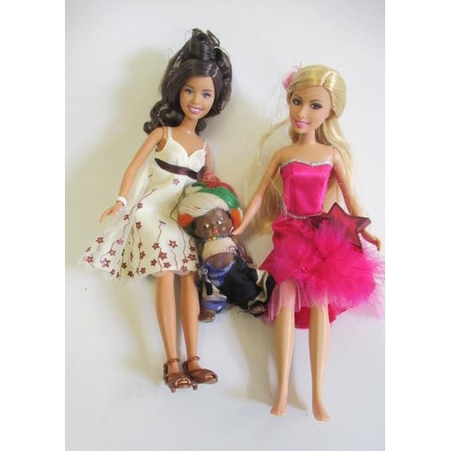 21 - A box of dolls clothing and shoes, including a replica Jumeau dress, together with two late Barbie s... 