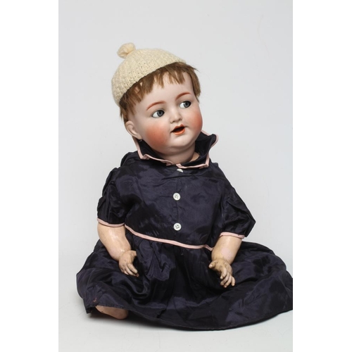 22 - A Kammer & Reinhardt bisque socket head character doll, with blue glass flirty eyes, sleeping eyelid... 